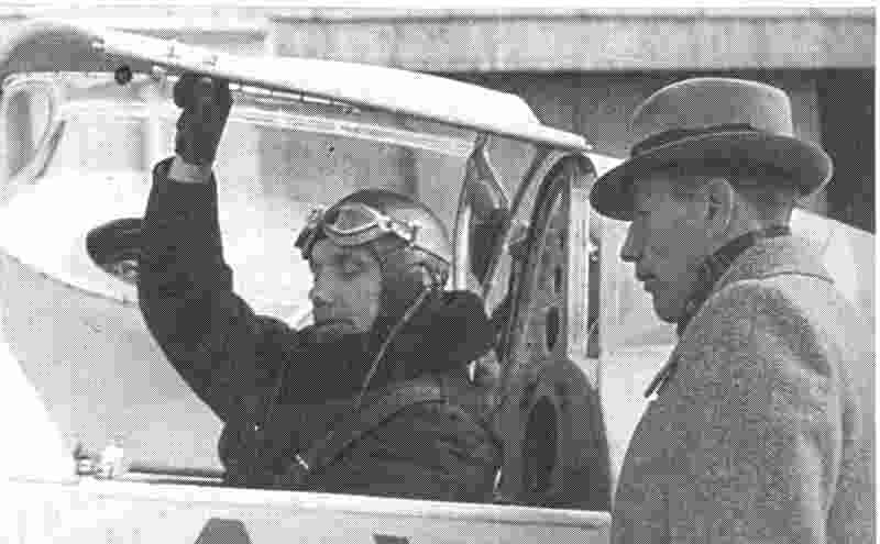 Designer Irbitis confers with test pilot Mikelsons in the cockpit of the I-16
